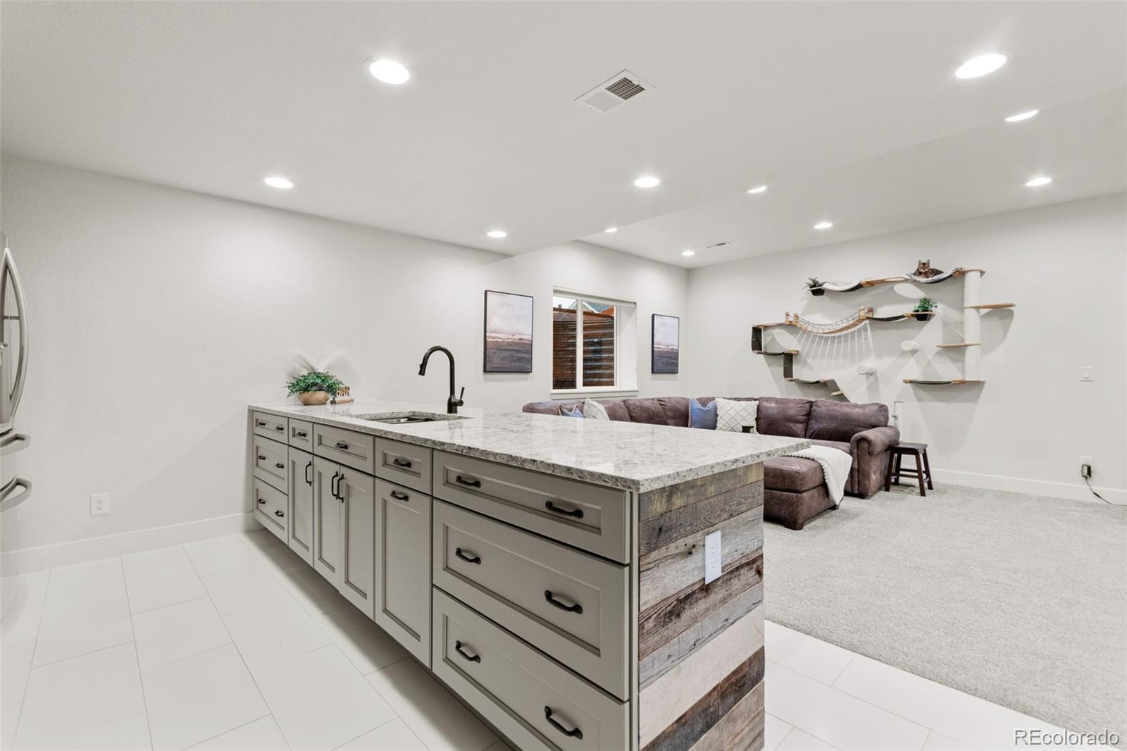 9388 Dunraven Loop Arvada, CO 80007 - Photo 40 of 50 a spacious bathroom with double vanity and mirrors