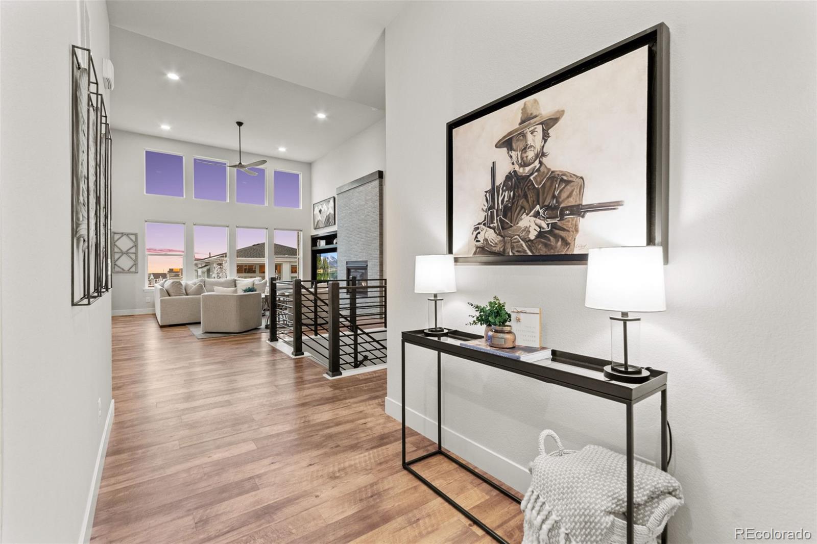9388 Dunraven Loop Arvada, CO 80007 - Photo 4 of 50 a living room with furniture and wooden floor