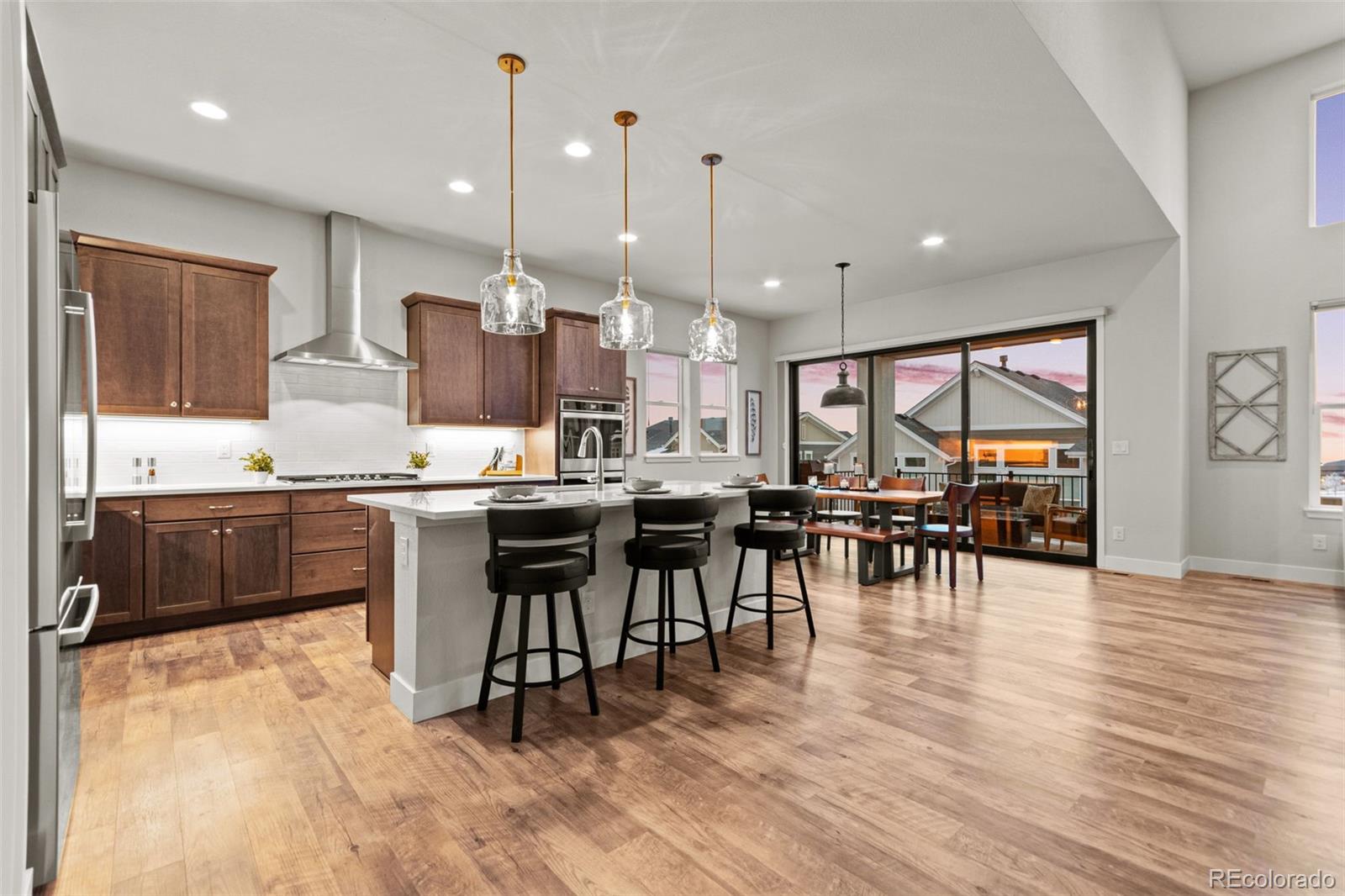 9388 Dunraven Loop Arvada, CO 80007 - Photo 7 of 50 a kitchen with lots of counter space and appliances