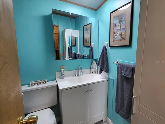 a bathroom with a shower curtain and a shower curtain