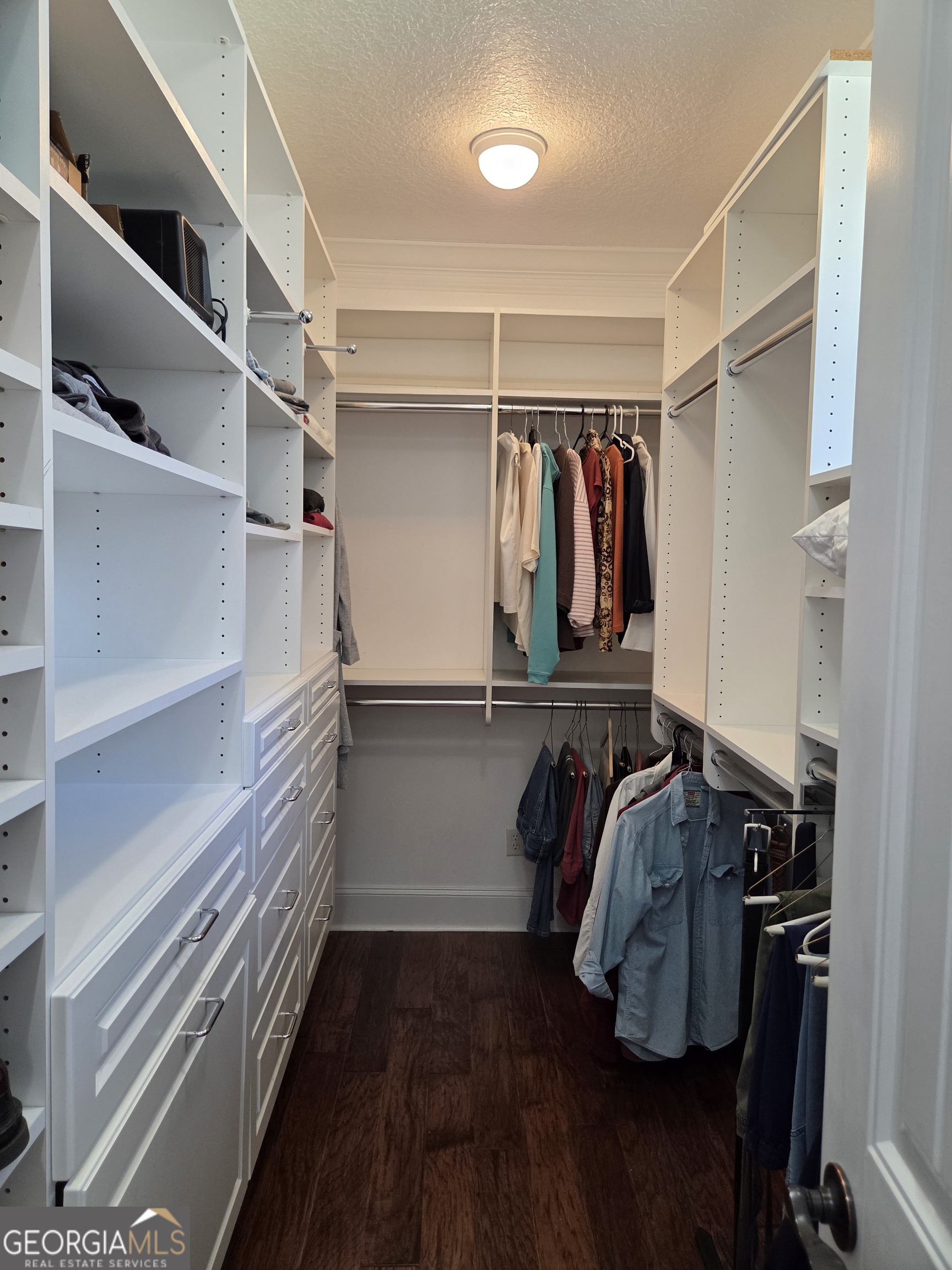 300 Hammond Powell Road Hazlehurst, GA 31539 - Photo 59 of 91 a view of walk in closet with clothes and shoes