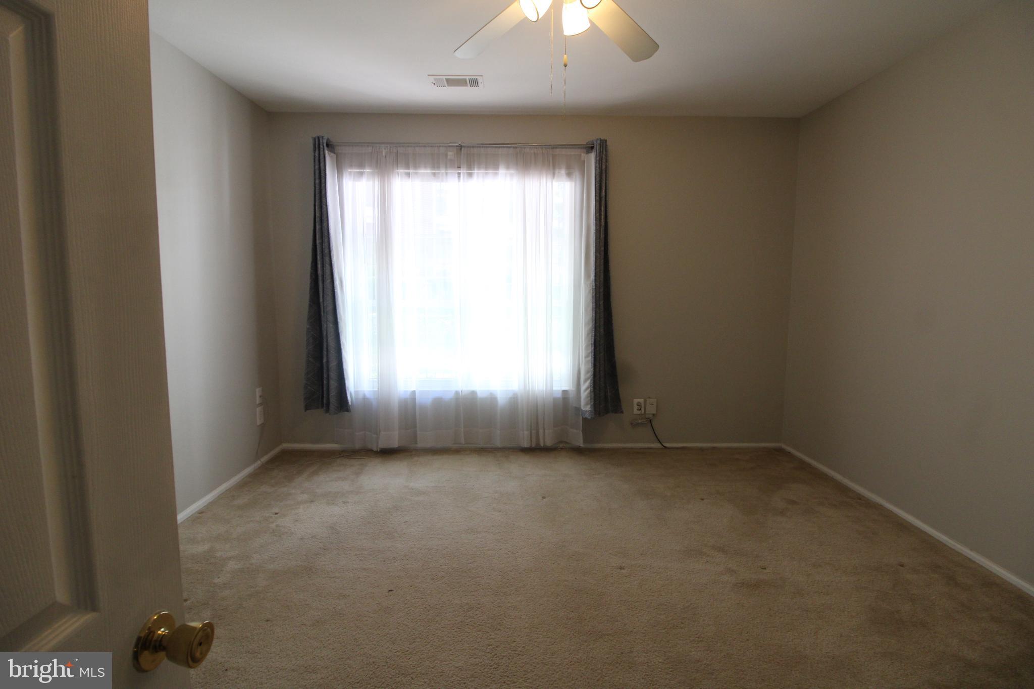 1570 Spring Gate Dr., Unit 7108 McLean, VA 22102 - Photo 16 of 21 an empty room with a window