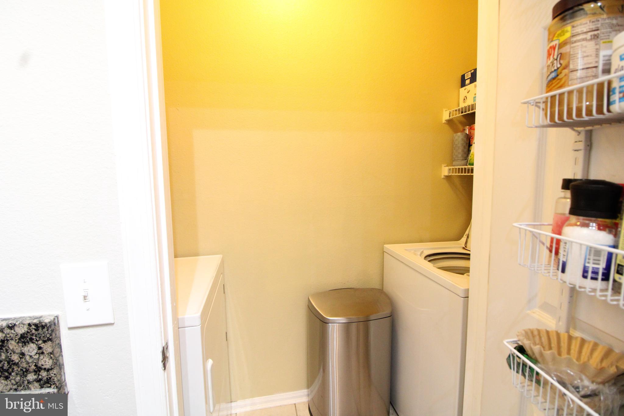 1570 Spring Gate Dr., Unit 7108 McLean, VA 22102 - Photo 6 of 21 a utility room with dryer and washer
