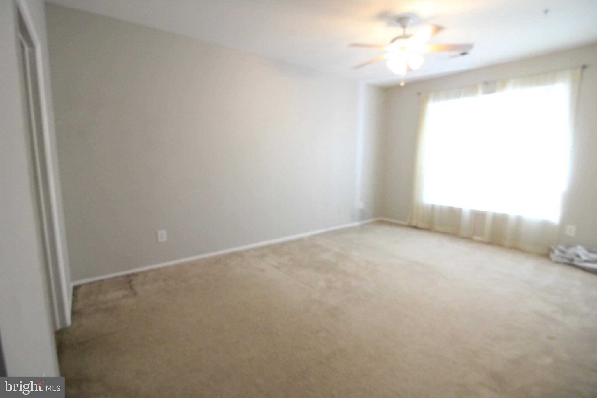 1570 Spring Gate Dr., Unit 7108 McLean, VA 22102 - Photo 9 of 21 an empty room with a window