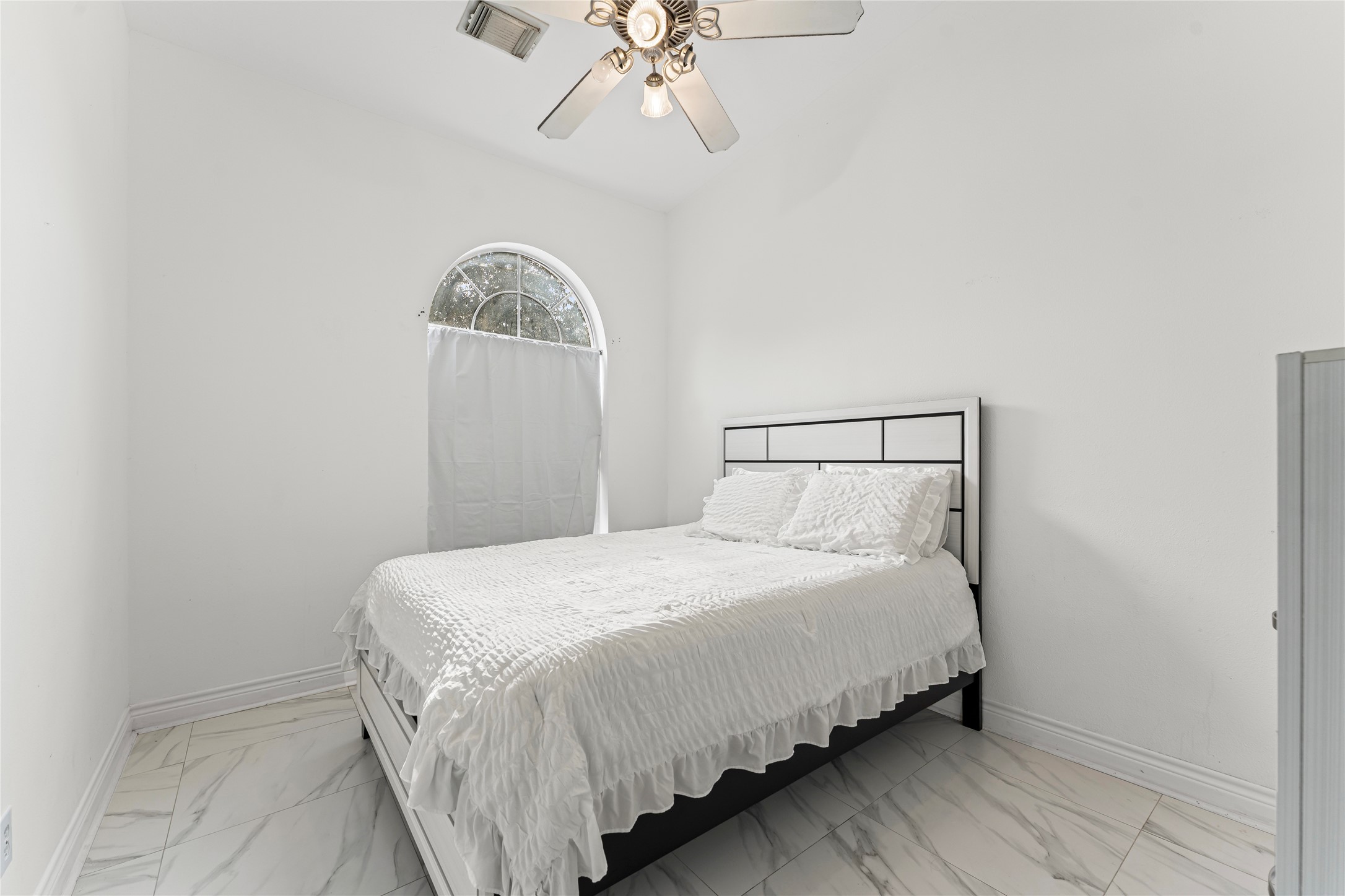 822 Green Pines Forest Houston, TX 77067 - Photo 14 of 18 a bedroom with a bed and a chandelier