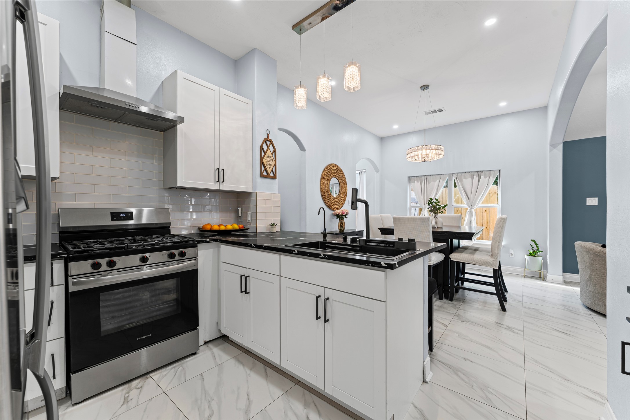 822 Green Pines Forest Houston, TX 77067 - Photo 6 of 18 a kitchen with stainless steel appliances granite countertop a stove and cabinets
