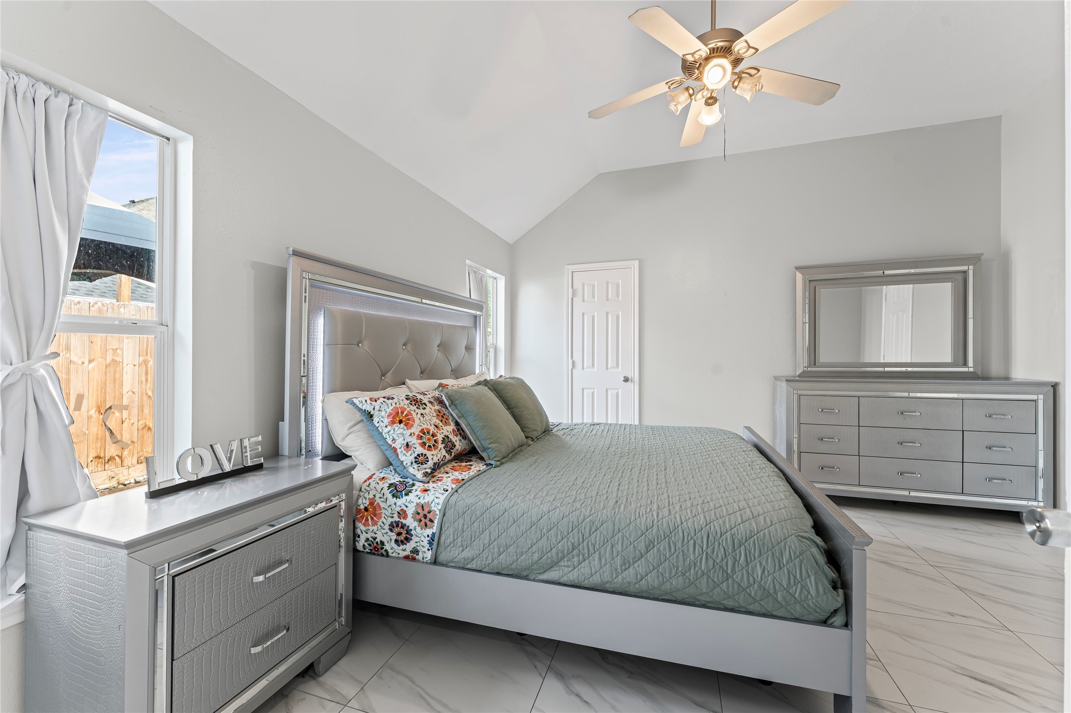 822 Green Pines Forest Houston, TX 77067 - Photo 8 of 18 a bedroom with a bed and a dresser