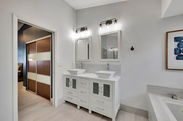 a bathroom that has a glass shower door