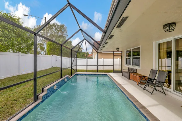 a view of swimming pool with seating space