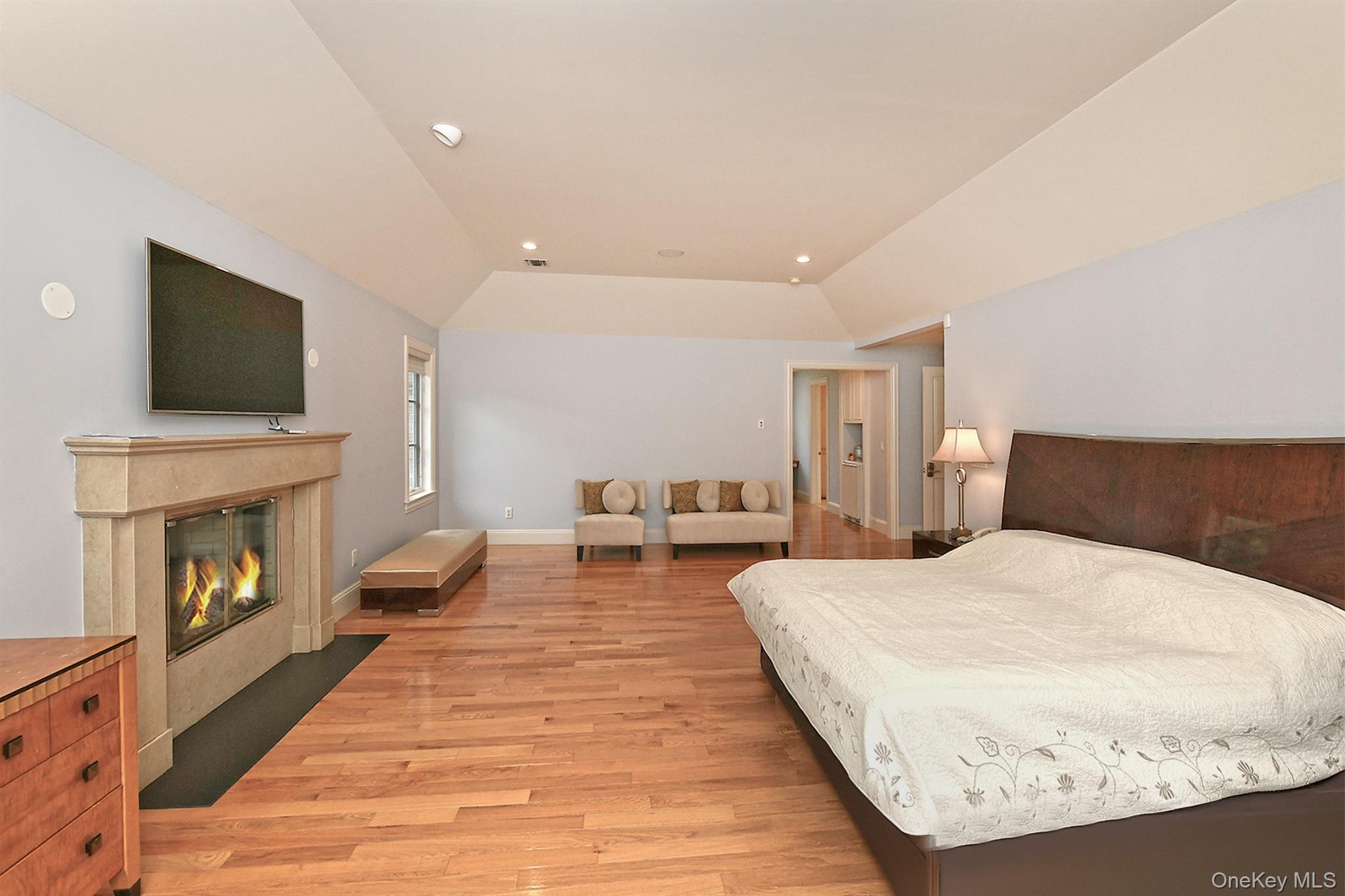 14 Norgate Road Glen Head, NY 11545 - Photo 21 of 44 a spacious bedroom with a bed and a flat screen tv