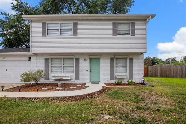 front view of a house with a yard