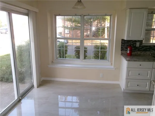 a view of a kitchen with a window