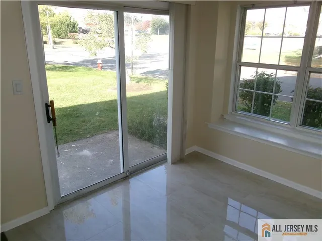 a view of an empty room and window