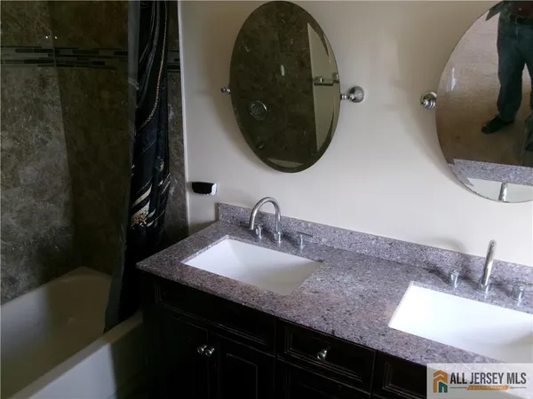 a bathroom with a sink and a mirror