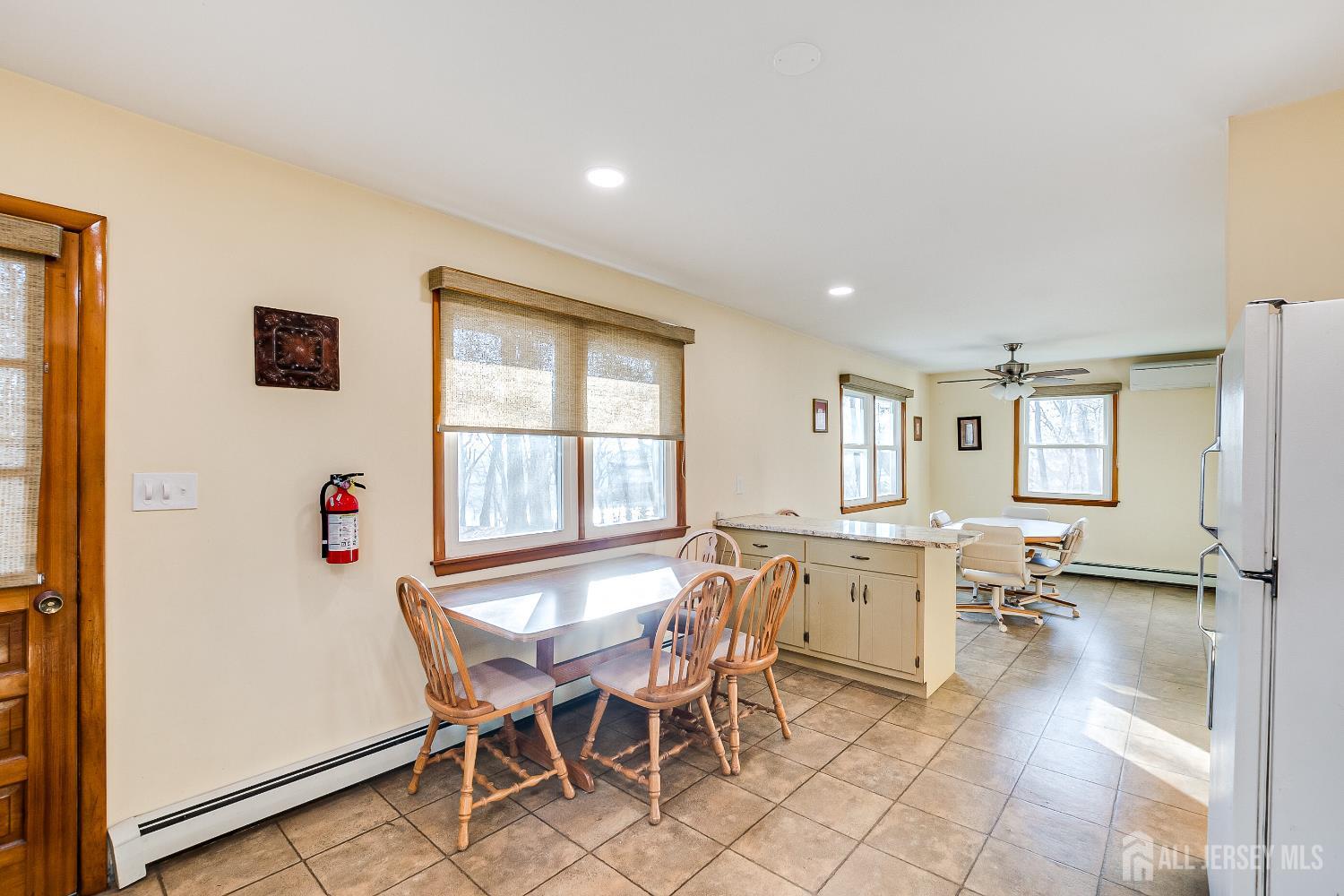 92 Coleman Street Edison, NJ 08817 - Photo 13 of 32 a view of a dining room with furniture and a window
