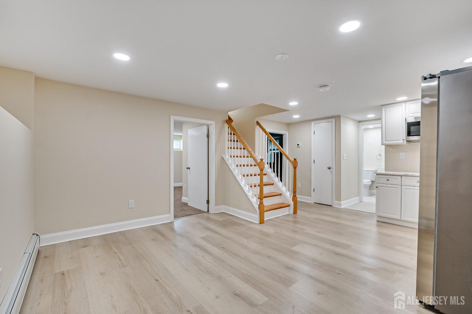92 Coleman Street Edison, NJ 08817 - Photo 22 of 32 a view of an empty room with wooden floor