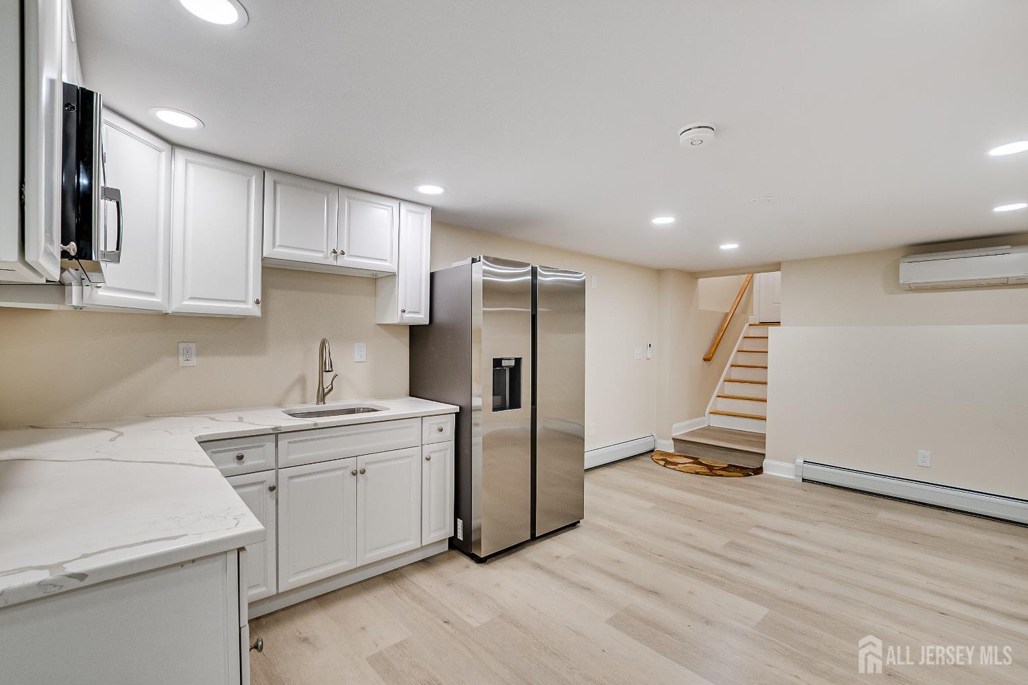 92 Coleman Street Edison, NJ 08817 - Photo 24 of 32 a kitchen with stainless steel appliances a refrigerator sink and cabinets