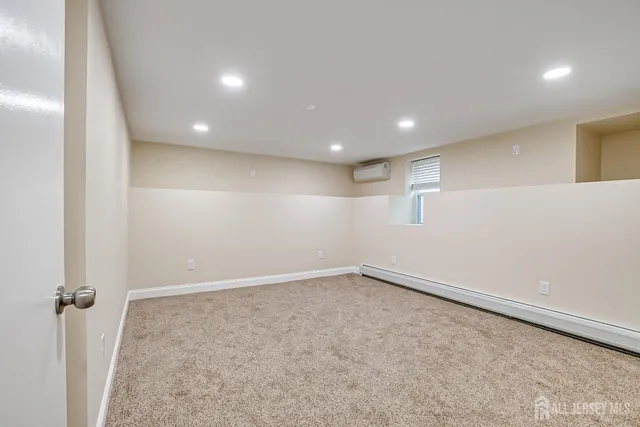 an empty room with a empty space and windows