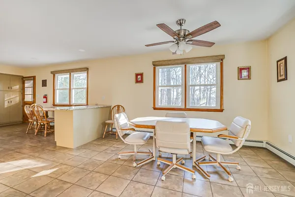 a work room with a window and wooden floor