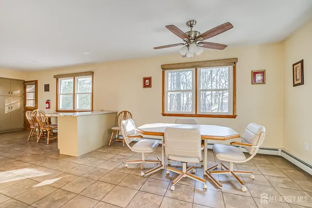 a work room with a window and wooden floor