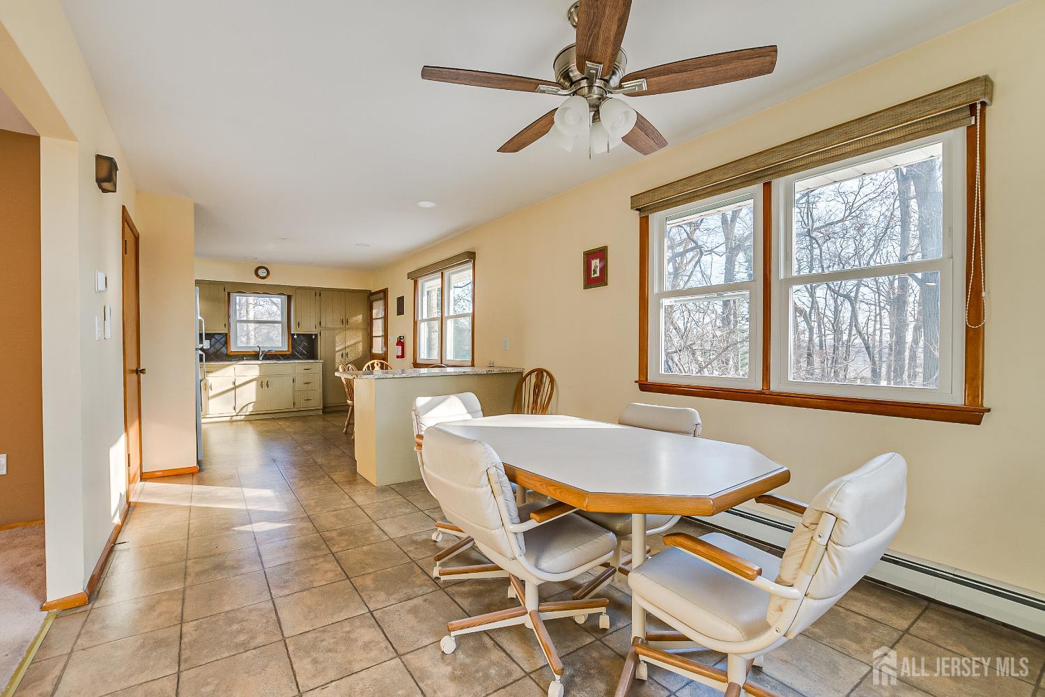 92 Coleman Street Edison, NJ 08817 - Photo 9 of 32 a living room with a dining table and a table with wooden floor