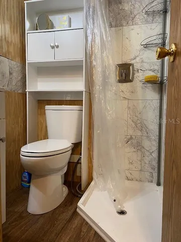 a bathroom with a toilet and a sink