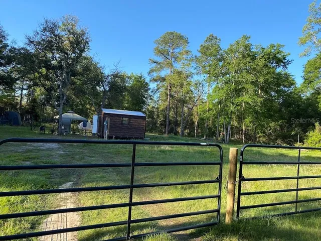 a view of a wooden fence