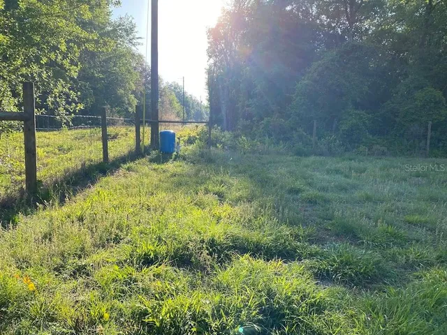 a view of swimming pool with a yard
