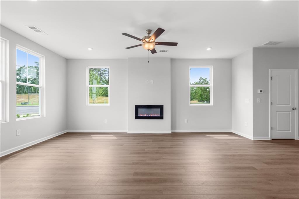 115 Pk Rdg Circle Cartersville, GA 30120 - Photo 5 of 25 a view of an empty room with wooden floor and a window