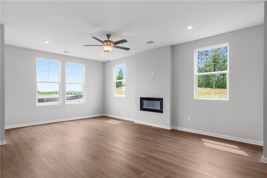 115 Pk Rdg Circle Cartersville, GA 30120 - Photo 6 of 30 a view of an empty room with wooden floor and a window