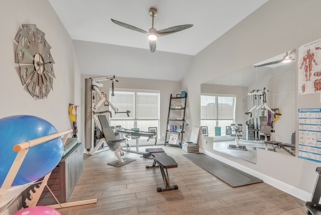 1541 North Blue Bonnet Lane Angleton, TX 77515 - Photo 17 of 28 a living room with furniture and wooden floor