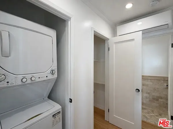 a view of a storage & utility room with washer and dryer
