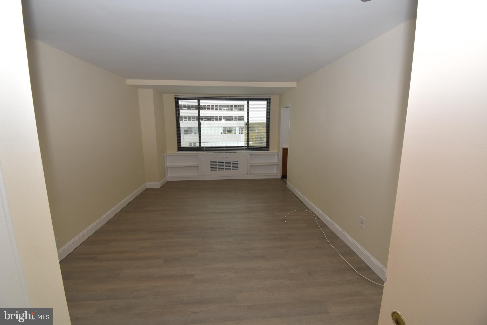 1011 Arlington Boulevard, Unit 710 Arlington, VA 22209 - Photo 4 of 10 an empty room with windows