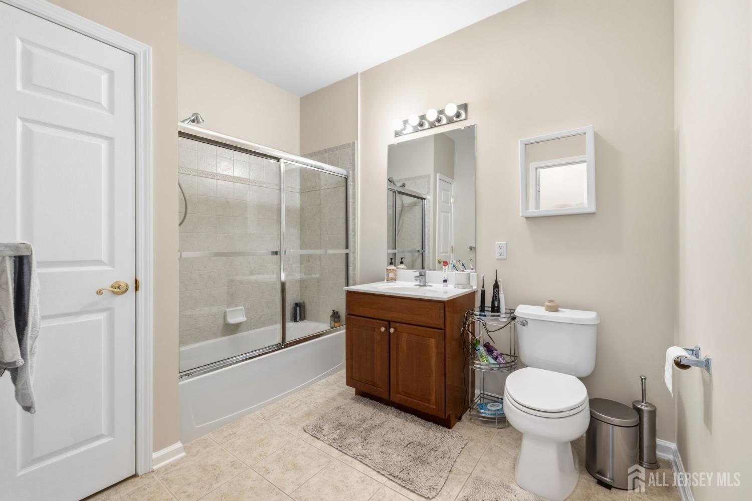 540 Cranbury Road, Unit 107 East Brunswick, NJ 08816 - Photo 13 of 20 a bathroom with a toilet sink and shower