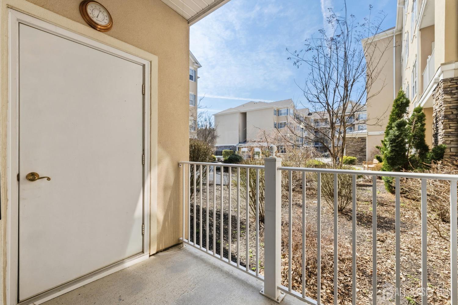 540 Cranbury Road, Unit 107 East Brunswick, NJ 08816 - Photo 15 of 20 a view of a balcony with wooden fence