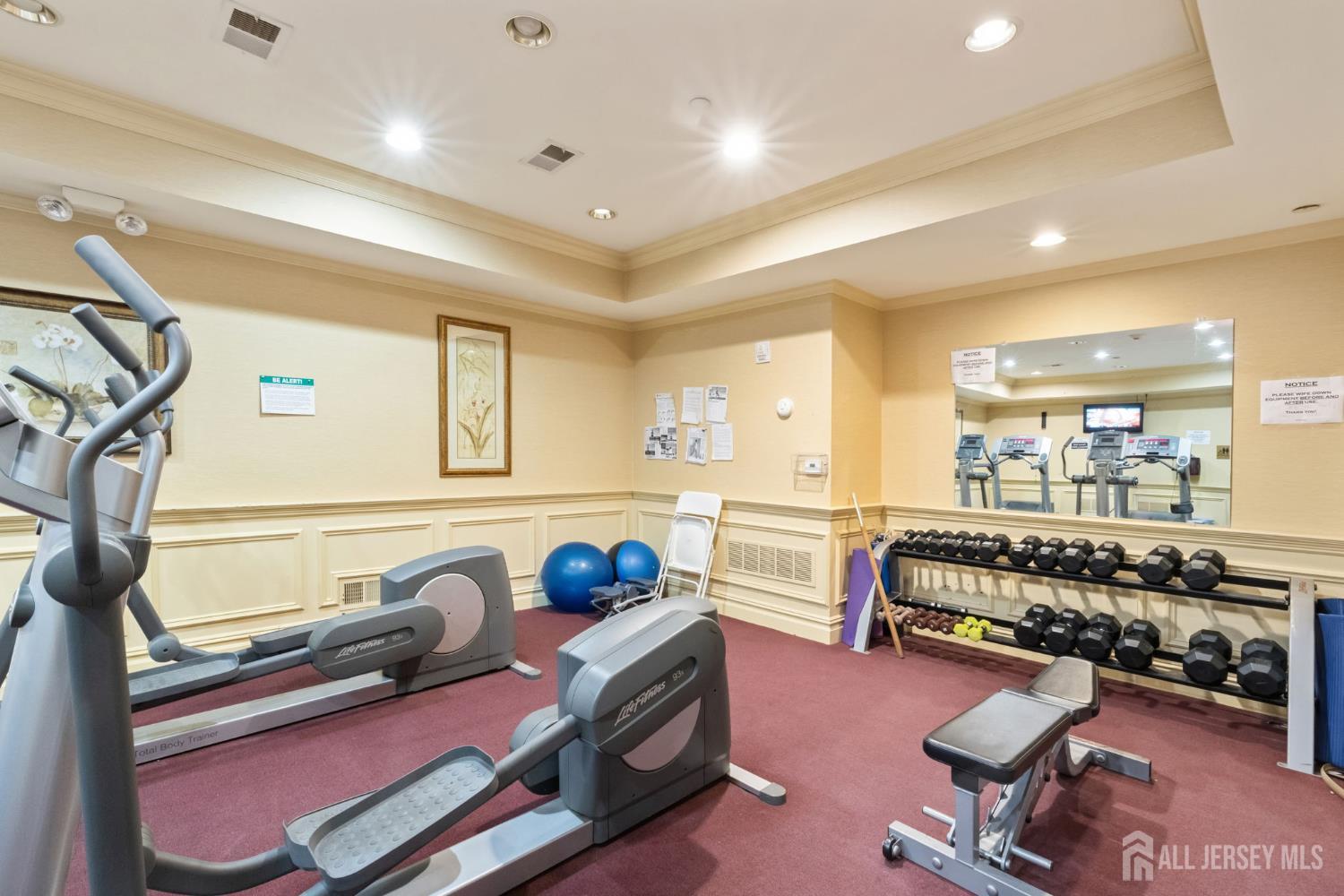 540 Cranbury Road, Unit 107 East Brunswick, NJ 08816 - Photo 17 of 20 a reading room with furniture and a wooden floor