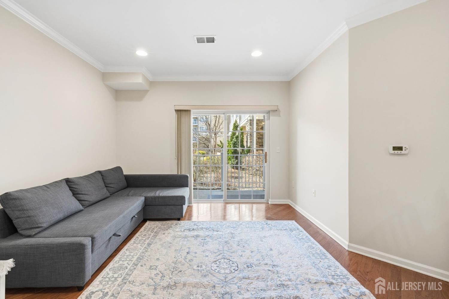 540 Cranbury Road, Unit 107 East Brunswick, NJ 08816 - Photo 4 of 20 a living room with furniture and a window