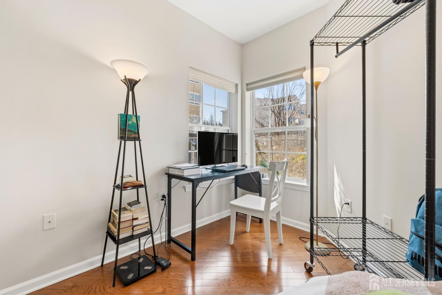 540 Cranbury Road, Unit 107 East Brunswick, NJ 08816 - Photo 8 of 20 a view of a livingroom with furniture and wooden floor
