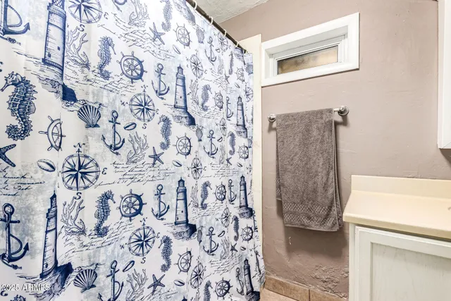 a bedroom with bed and a window