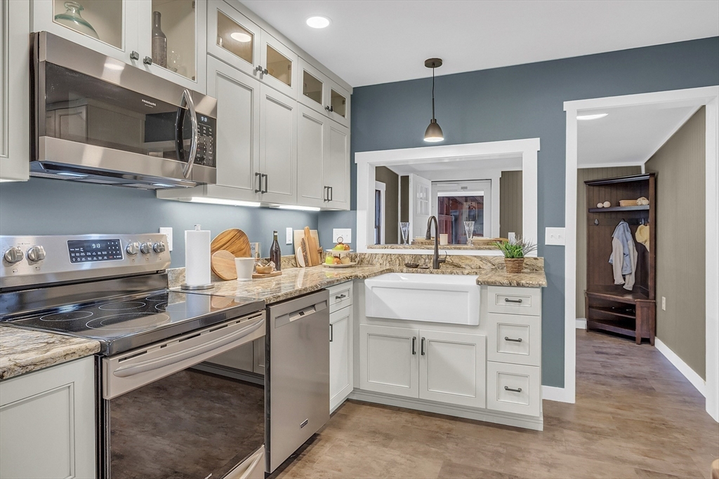 4287 South Athol Road Athol, MA 01331 - Photo 17 of 42 a kitchen with stainless steel appliances granite countertop a sink and cabinets