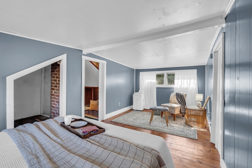 4287 South Athol Road Athol, MA 01331 - Photo 36 of 42 a bedroom with a bed and wooden floor