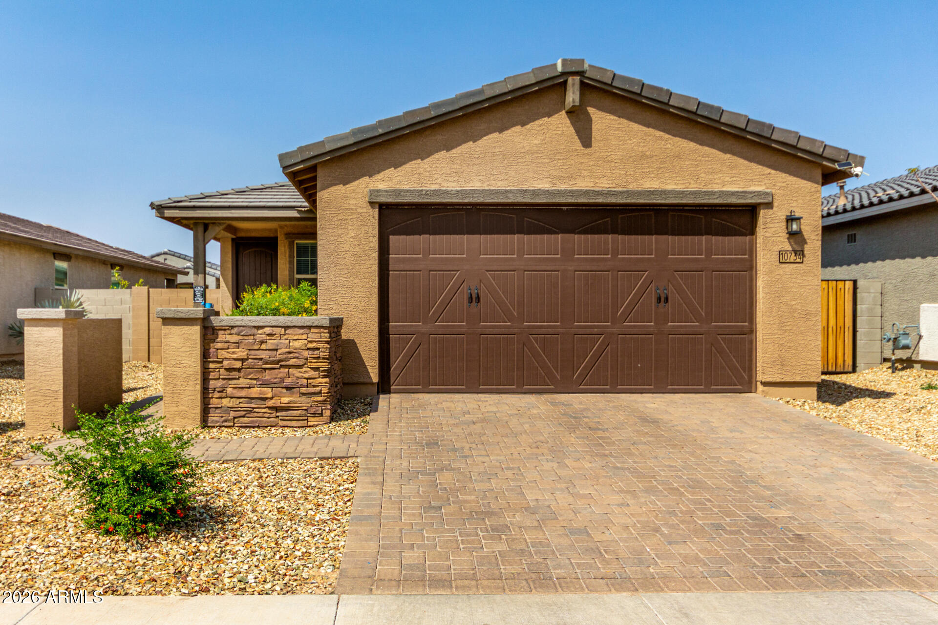 a front view of a house with a garage