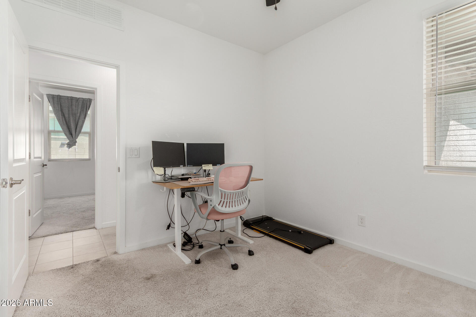 10734 West Bloch Road Tolleson, AZ 85353 - Photo 16 of 20 a room with a window and chairs