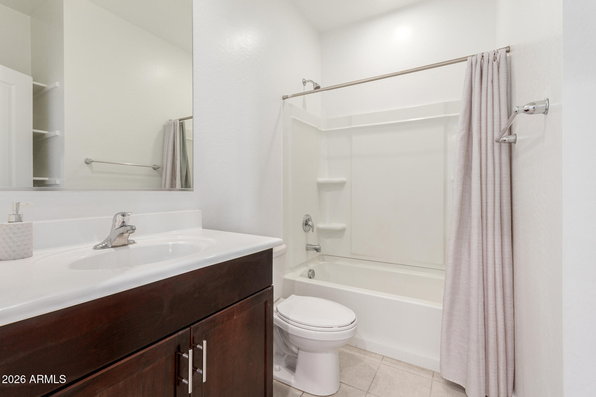 10734 West Bloch Road Tolleson, AZ 85353 - Photo 17 of 20 a bathroom with a sink a toilet and shower