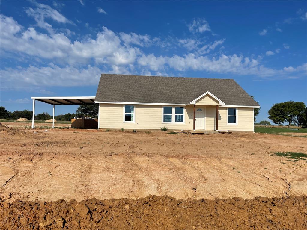 2008 Brown Loop Poolville, TX 76487 - Photo 1 of 1 a front view of a house with a yard