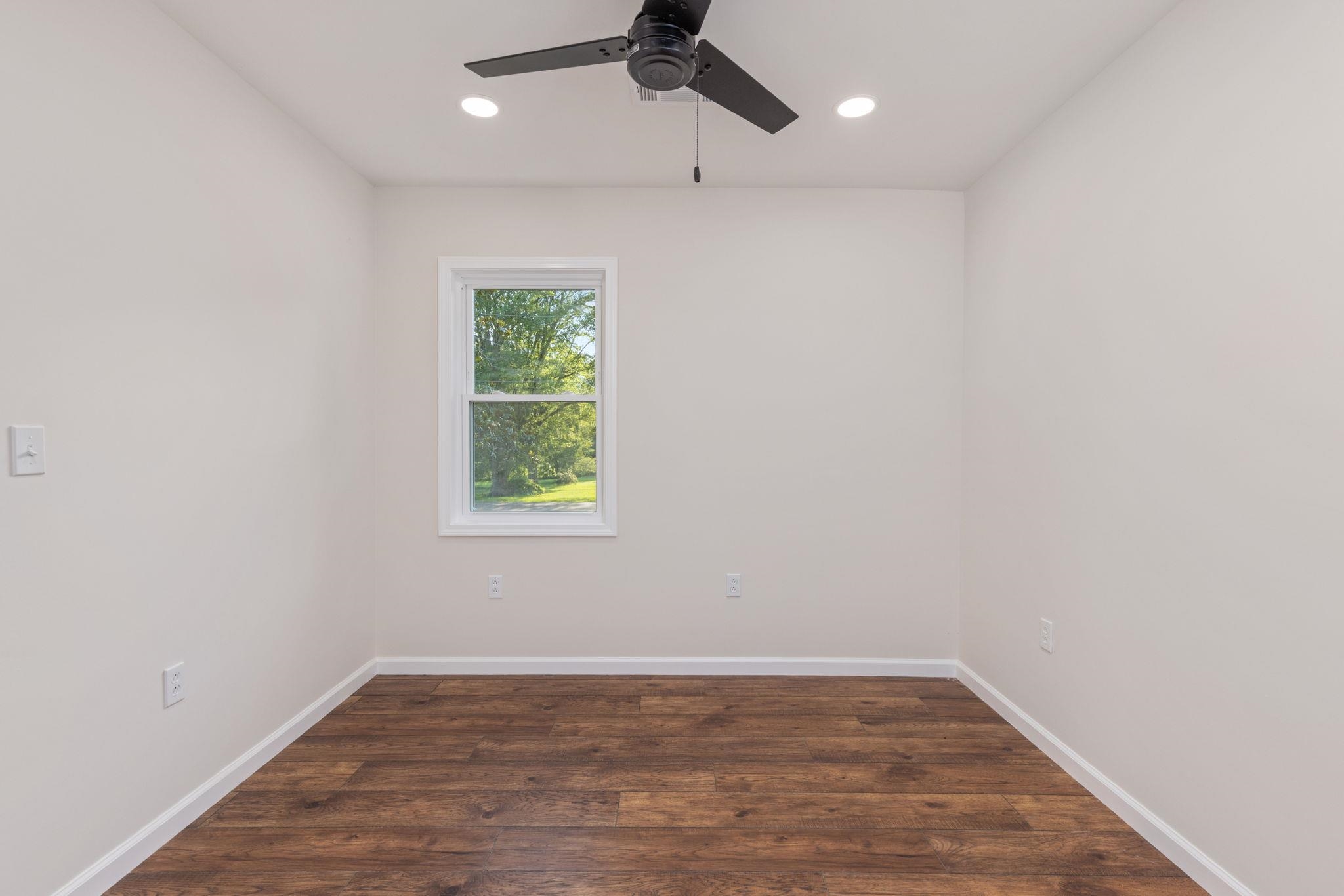 17 County Road 233 Corinth, MS 38834 - Photo 18 of 40 Empty room featuring a ceiling fan, recessed lighting, and wood finished floors