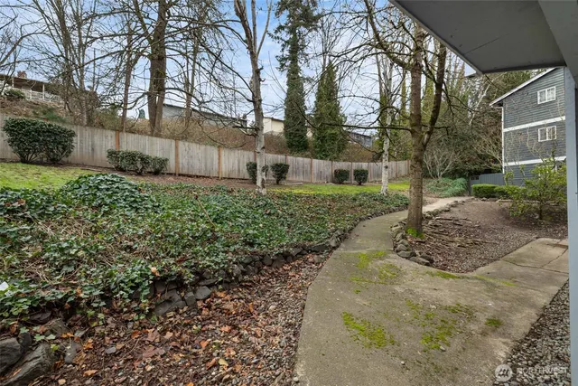 a backyard of a house with lots of green space