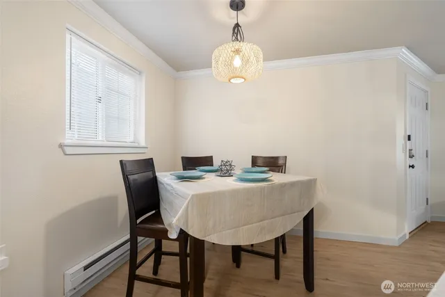 a view of a dining room with furniture and chandelier