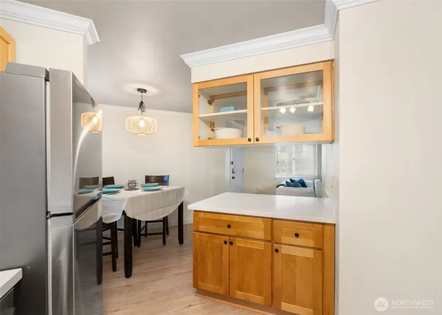 a kitchen with a sink and a refrigerator