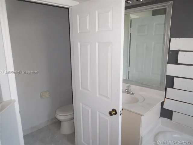 a bathroom with a toilet and shower